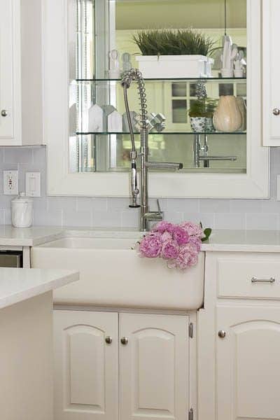 Our DIY Kitchen Remodel. We took our 90's kitchen with oak cabinets and updated it and now it is white, bright, and beautiful.