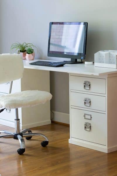I made this desk with 2 thrifted file cabinets and a board.